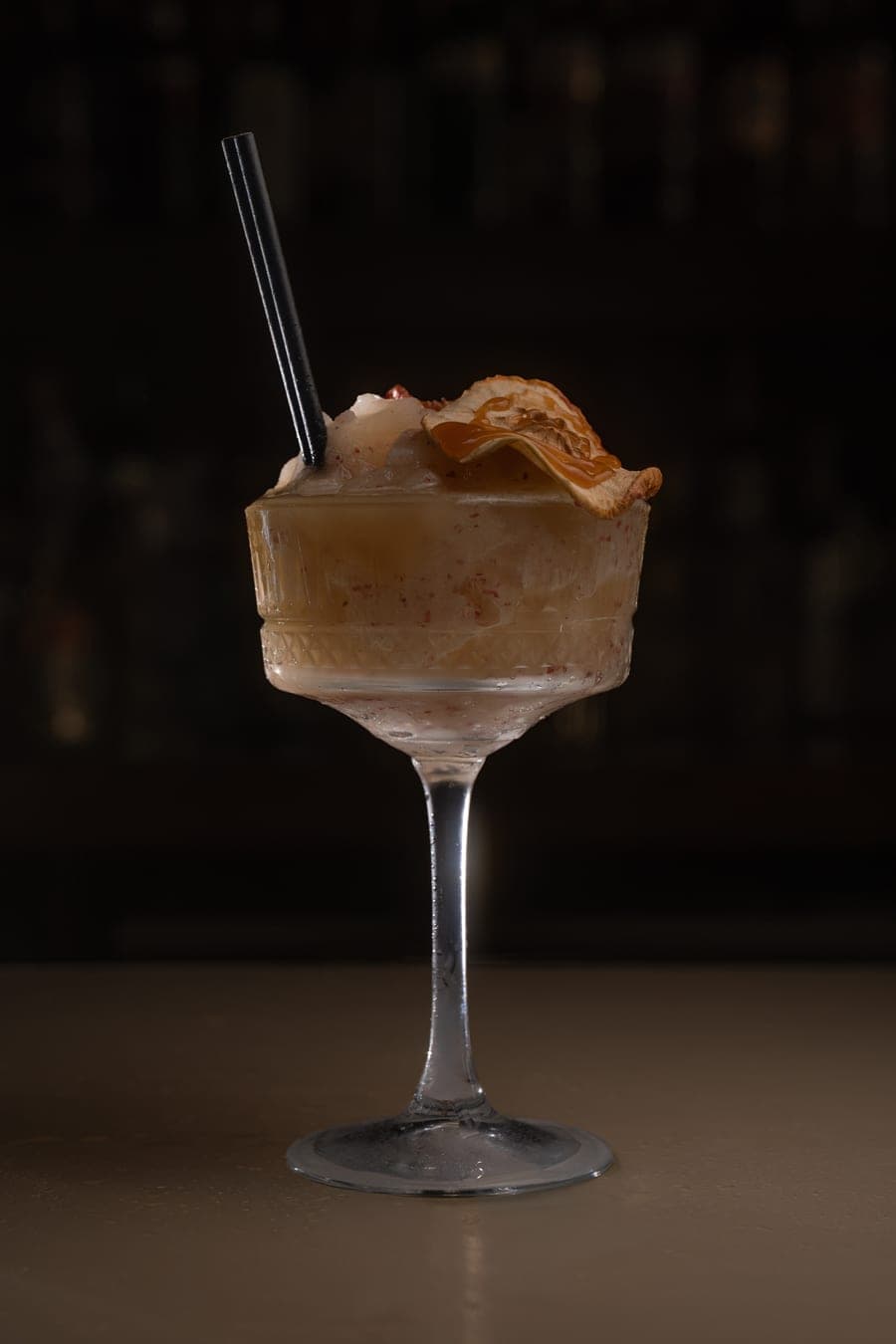 Frozen cocktail with a caramel apple garnish at HOME Buckshaw